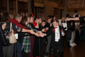 Night to Shine guest on the red carpet. 